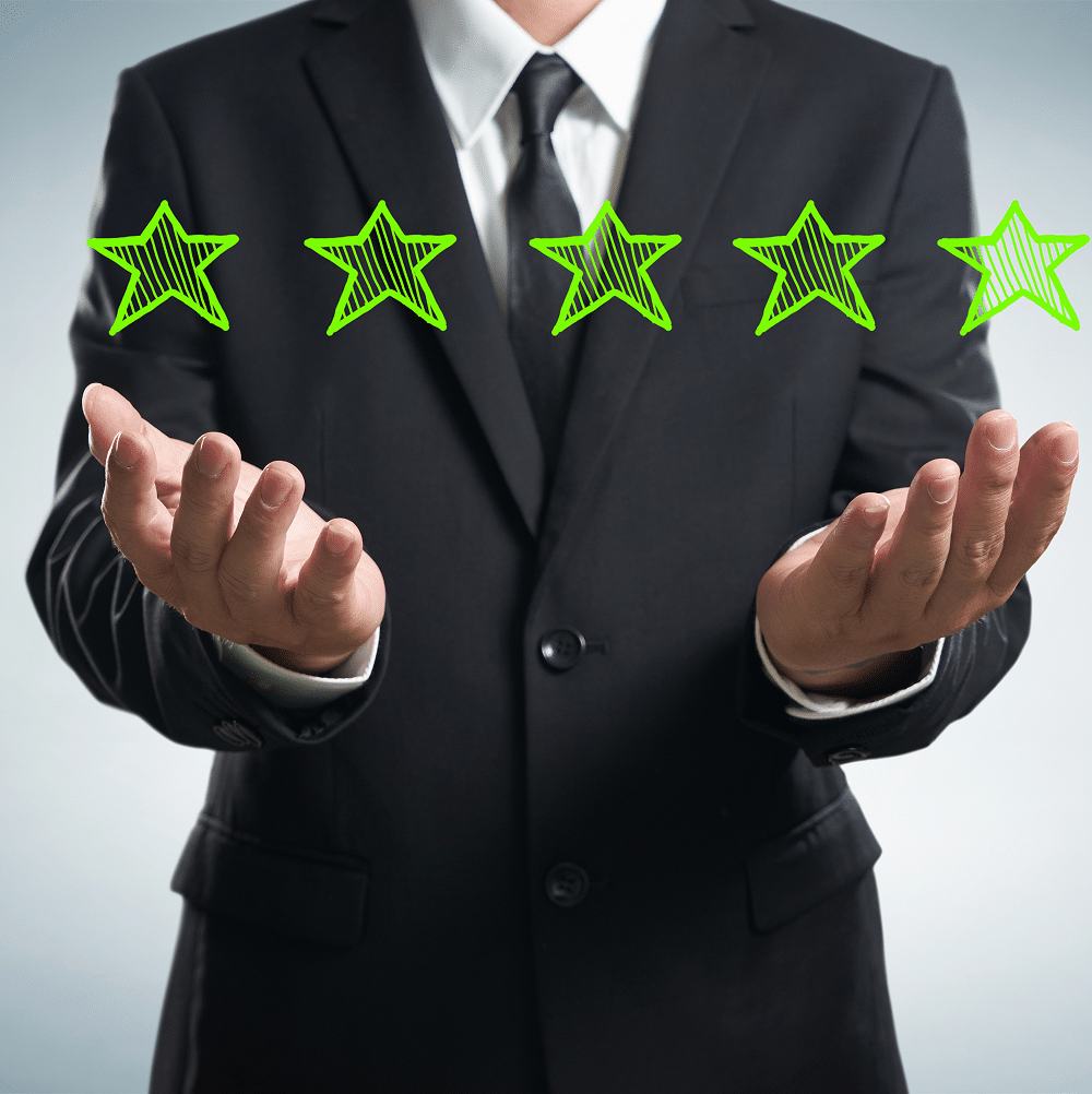 businessman-holding-five-star-rating-SBI-301985838 1